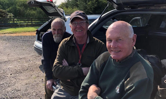 Three happy anglers