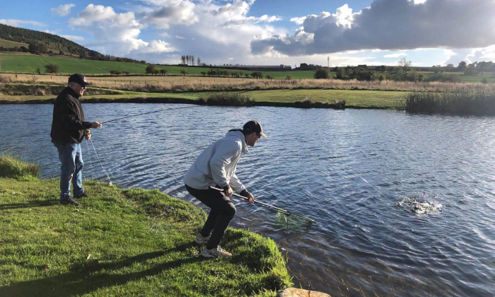 Anglers about to net their fish